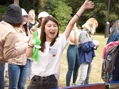 Student winning a prize at fairground